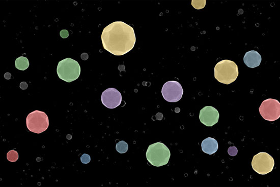 Colored scanning electron microscopy image showing multiple high-index-facet high-entropy alloy nanoparticles in the field of view