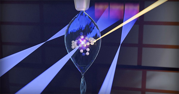 Artist's impression of a split beam with vitamin B12 in liquid jet