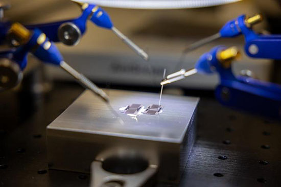 The acoustic atom is a chip-scale device, worked on at the microscopic level