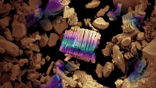 A stylized scanning electron microscopy image of a multi-layer stack of MXenes