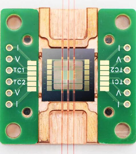 a pico-calorimeter assembled on a metal mount with a custom printed circuit board.