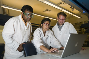 Ganesh Balasundaram, principal scientist at Nanovis LLC (from left), Monica M.C. Allain, managing director for Purdue's Birck Nanotechnology Center in Discovery Park, and Matt Hedrick, president and chief operating officer at Nanovis, discuss research related to spine repair using nanostructured biomaterials in a laboratory at Birck