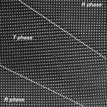 electron micrograph shows the boundaries between rhombohedral (R phase) and tetragonal (T phase) regions in a thin film of bismuth ferrite under epitaxial strain