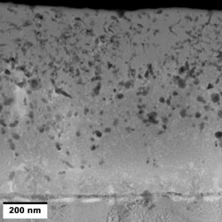 Cross-sectional transmission electron microscope image of the functionally graded smart coating with nano-silver particles distributed throughout the entire thickness of the coating.