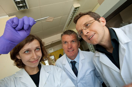 University of Warwick Chemistry PhD student Helena Stec with some ultra-thin gold film, watched by Professor Tim Jones, Chemistry, and Dr Ross Hatton, Chemistry all from The University of Warwick