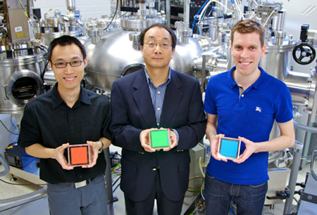 Z. Wang (PhD Candidate), Professor Zheng-Hong Lu, M. Helander (PhD Candidate + Vanier Canada Graduate Scholar) holding Cl-ITO enabled OLED devices