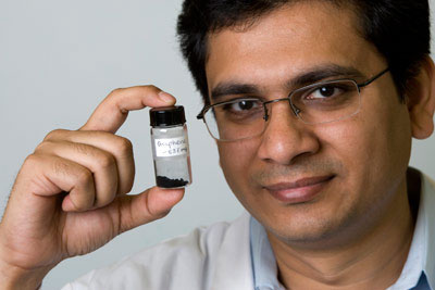 Amartya Chakrabarti holds up a sample of graphene