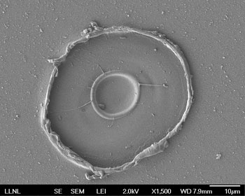 An electron micrograph image of a crater in an aluminum sample after it is is shocked and compressed
