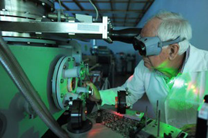 Prof. Jerzy Wolowski from IPPLM near the new laser ion source