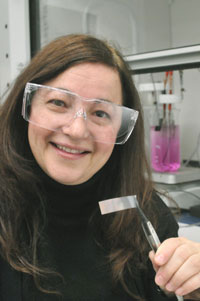 Argonne nanoscientist Tijana Rajh holds a strip of material created from titanium dioxide nanotubes