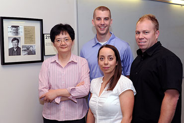 Kan Wang, a professor of agronomy; Justin Valenstein, a doctoral student in chemistry; Susana Martin-Ortigosa, a post-doctoral research associate in Wang's lab; and Brian Trewyn, an associate scientist in chemistry