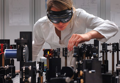 Nina Schwalb adjusting the femtosecond laser spectroscope