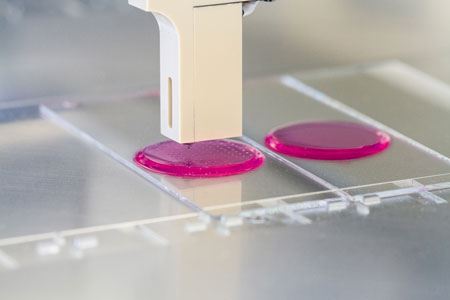 using inkjet printers to print cell suspensions onto shimmering pink hydrogel pads
