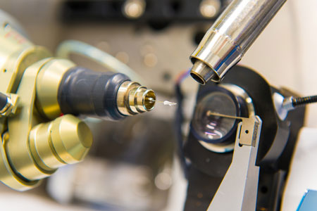 rotein crystal samples are placed on a small metal tip so X-rays from the adjacent beam pipe can pass through them and diffract off the atoms inside the crystal