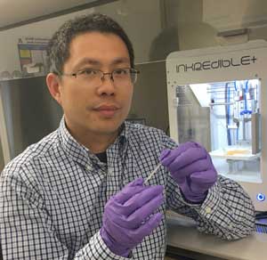 Yi Hong, UTA professor of bioengineering and leader of the project, shows his new hyrdogel