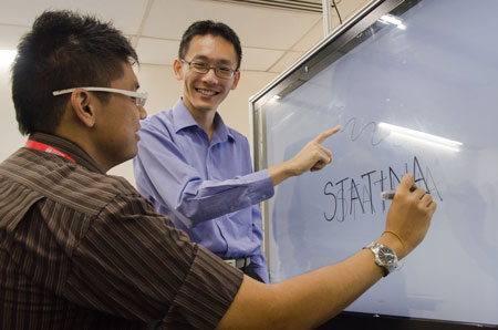 Asst Prof Andy Khong (right) with his undergraduate student Zaw Lin