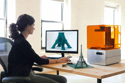 A user works away on Formlabs' Form 1 3-D printer and PreForm software
