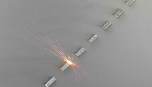 Direct metal laser melting (DMLM) machine in action
