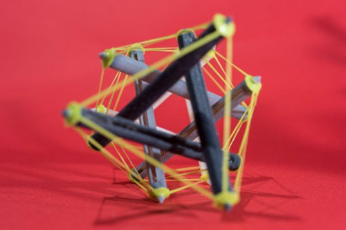 A 3-D printed object made with tensegrity, a structural system of floating rods in compression and cables in continuous tension