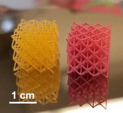 a yellow and a red 3D-Printed cubes