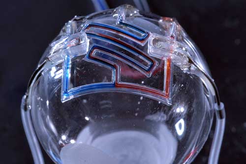 3D printed microfluidic channels on a curved surface