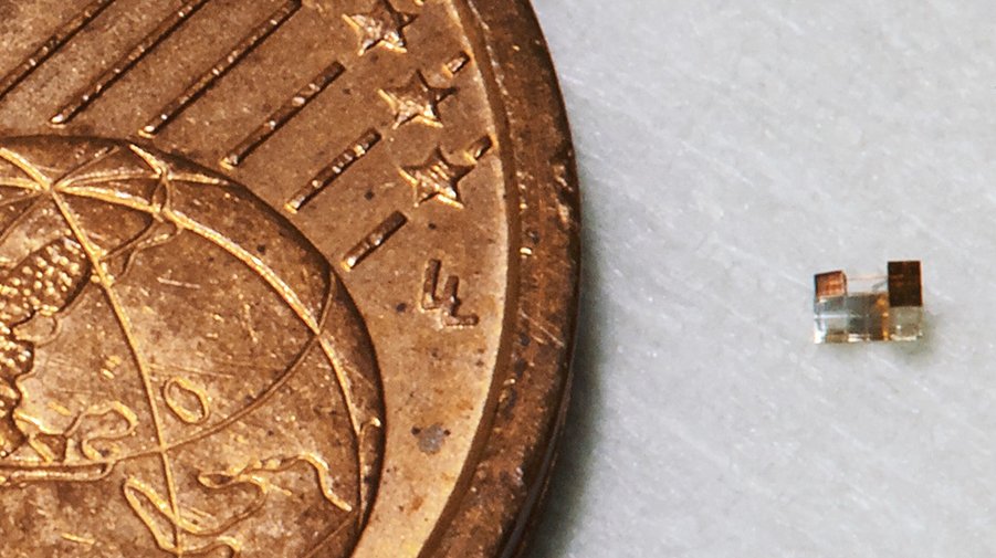 A 3D printed microelectromechanical systems (MEMS) is seen beside a 2 cent Euro coin