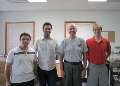 Virginia Tech’s Reza Arghandeh, an electrical and computer engineering Ph.D. candidate, second from left, works with his adviser Robert Broadwater, professor of electrical and computer engineering, third from left