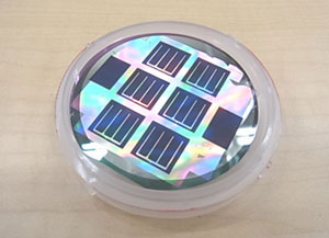 A microcrystalline silicon solar cell formed on a honeycomb-textured substrate