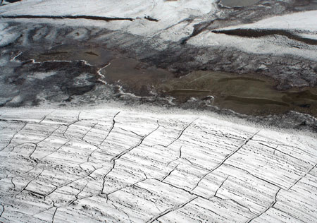 Cracks appearing in the permafrost signal that a thaw is coming