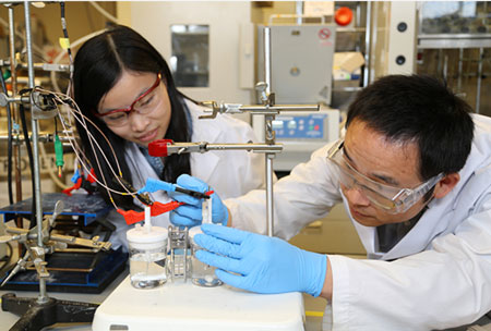 Researchers Xueli Zheng, left, and Dr. Bo Zhang