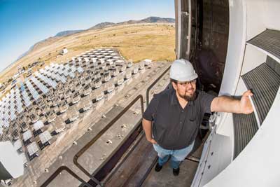 Sandia National Laboratories intern Jesus Ortega inspects one of the new bladed receivers at Sandia’s National Solar Thermal Testing Facility