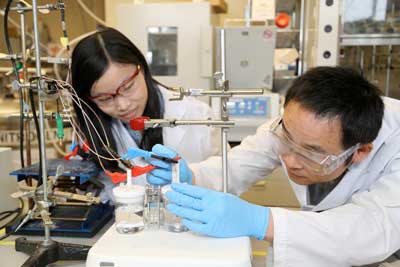 Researchers Xueli Zheng, left, and Bo Zhang