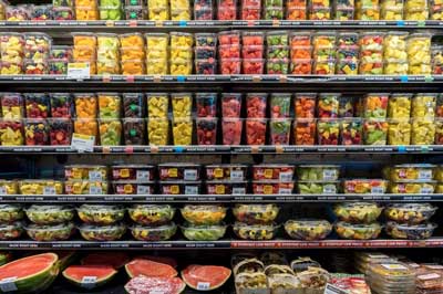 packaged fruit in supermarket shelves