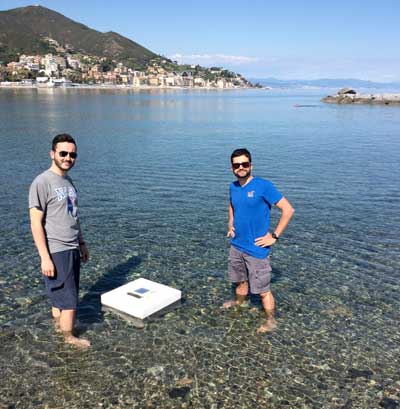 two researchers with a solar distiller during the tests carried out in the Ligurian Sea
