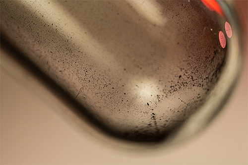 Metals settle at the bottom of a vial