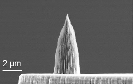 Diamond nano-tip integrated onto the micro-heater of a doped silicon microcantilever