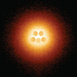 Scanning tunneling microscope image shows an artificial atomic nucleus on graphene, consisting of five pairs of calcium atoms