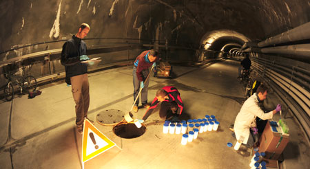 Collecting samples in a sewer channel 