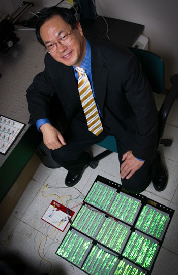 Georgia Tech professor Zhong Lin Wang poses with an array of 1,000 LED lights