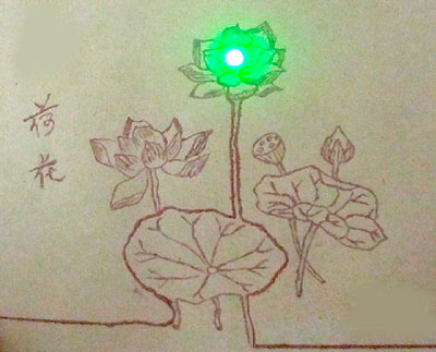 A picture drawn with conductive ink lights up a green LED