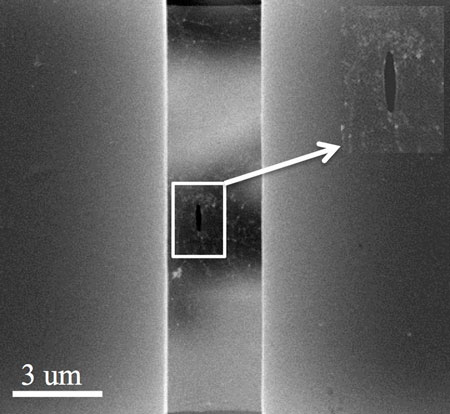 An electron microscope image shows a pre-crack in a suspended sheet of graphene