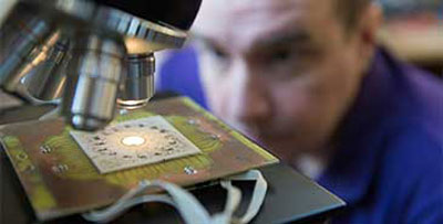 researcher with microscope