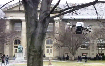 A flying robot avoids a tree on the Arts Quad