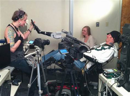 Tim Hemmes operates a mechanical prosthetic arm during a testing sessions