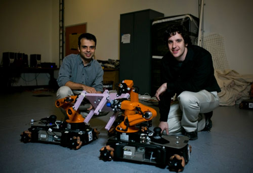 MIT postdoc Mehmet Dogar (left) and graduate student Andrew Spielberg