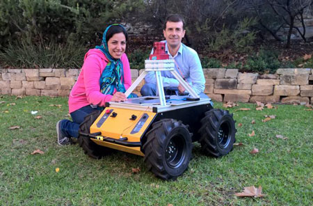 University of Adelaide Ph.D. student Zahra Bagheri and supervisor Professor Benjamin Cazzolato (School of Mechanical Engineering) with a robot