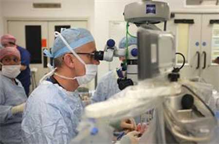 Professor Robert MacLaren praised the success of the world’s first robotic operation inside the eye
