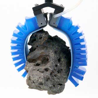 Robotic gripper holding a rock