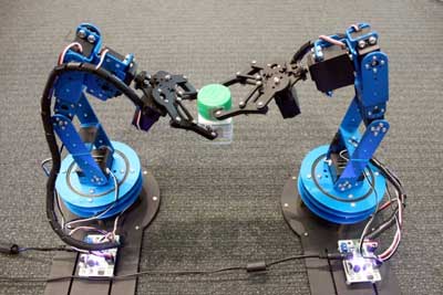 two robots moving an object