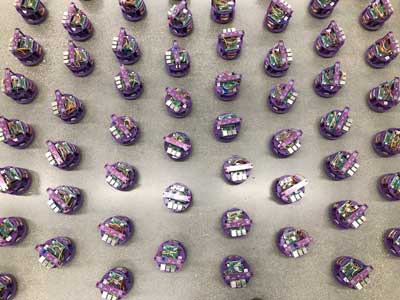One hundred small robots line up in the laboratory